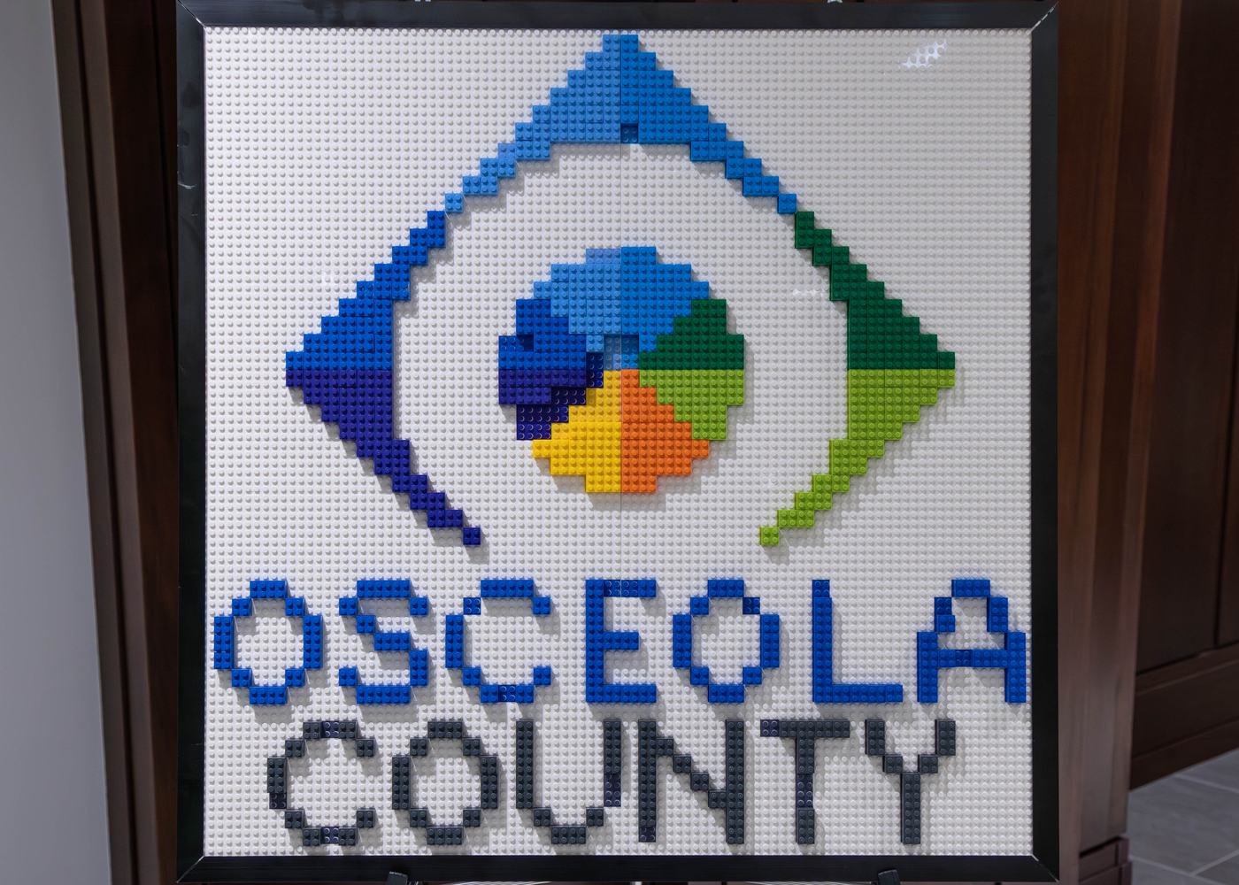 A finished pre-assembled logo mosaic framed and ready to hang