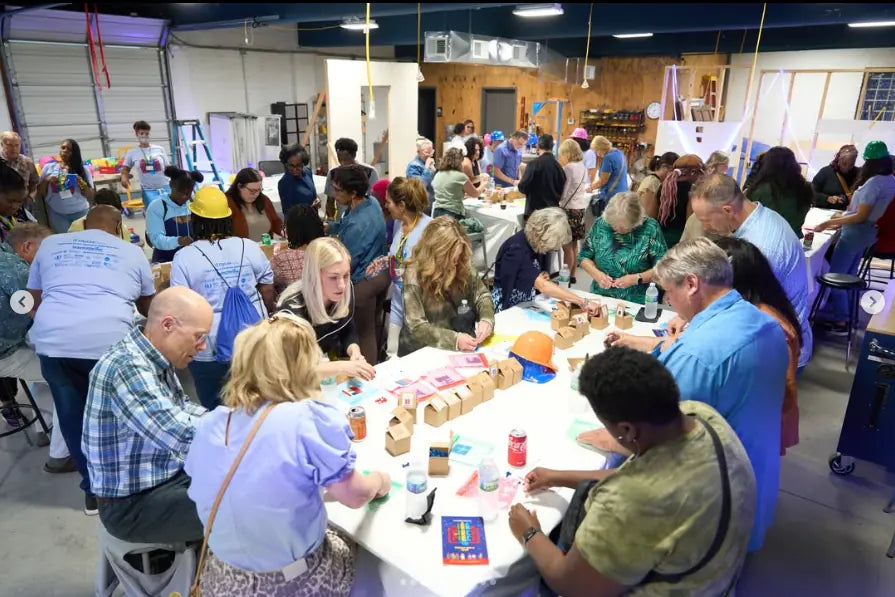 A large team activation crowd building a brand mosaic together